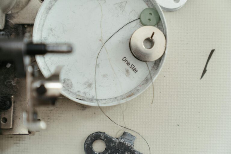 Detailed view of sewing machine parts and accessories showcasing needlework tools.